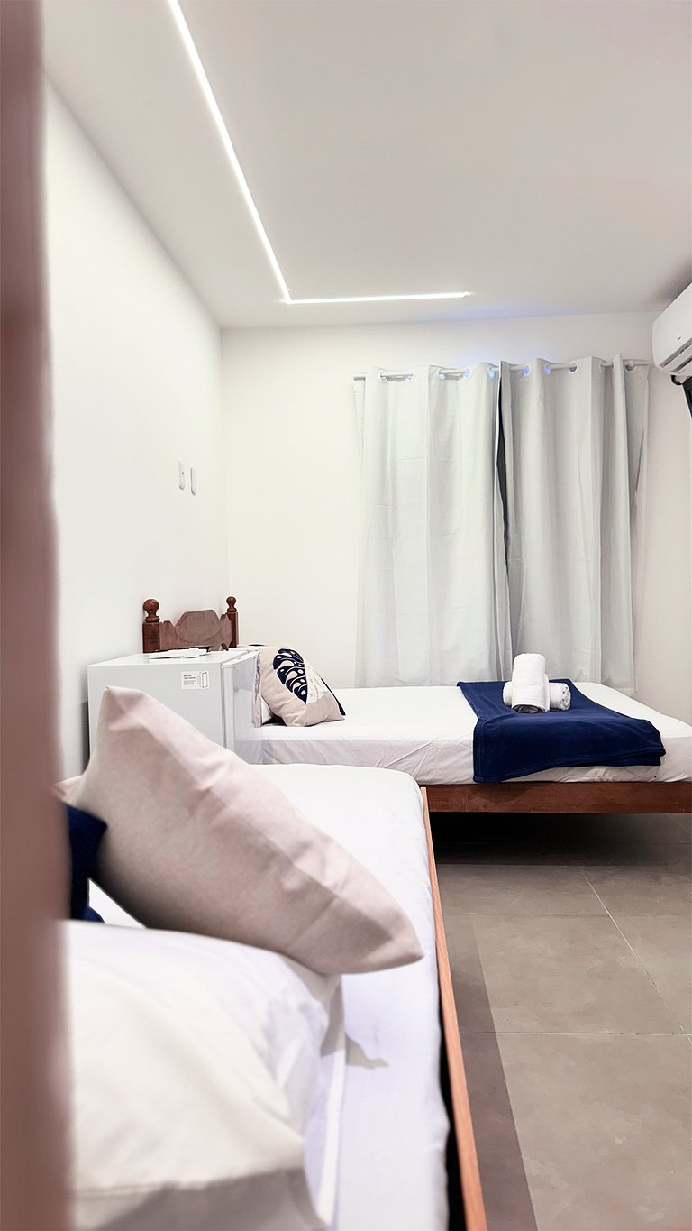 Suíte Família com AR frigobar bem no centro