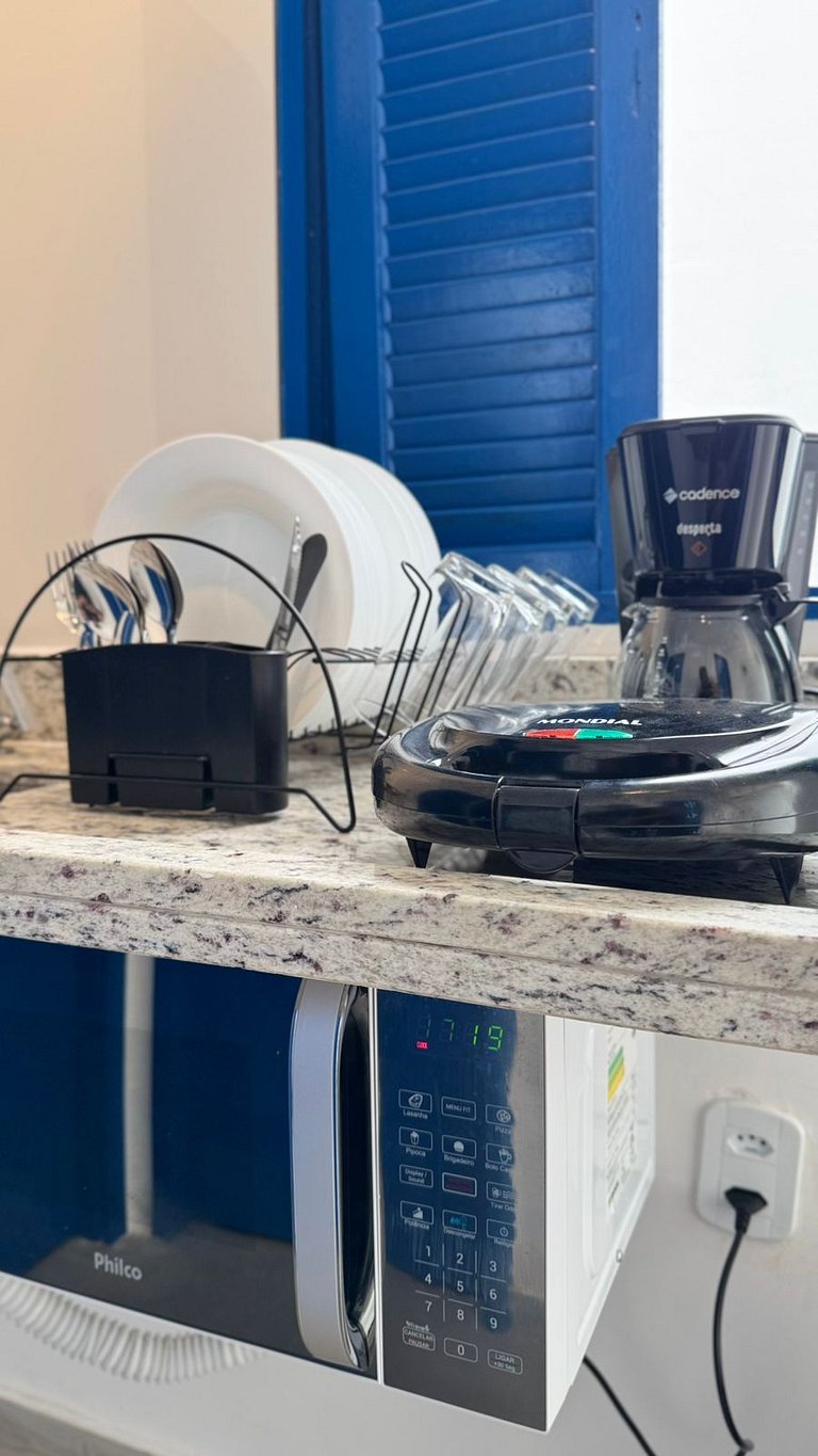 Suíte Solteiro com AR frigobar bem no centro