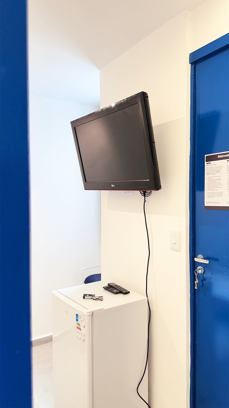 Suíte Solteiro com AR frigobar bem no centro